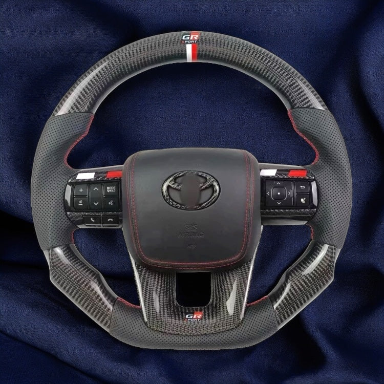 TOYOTA Hilux (2012-2024) - Carbon Fiber + Leather Steering Wheel with Airbag and Buttons