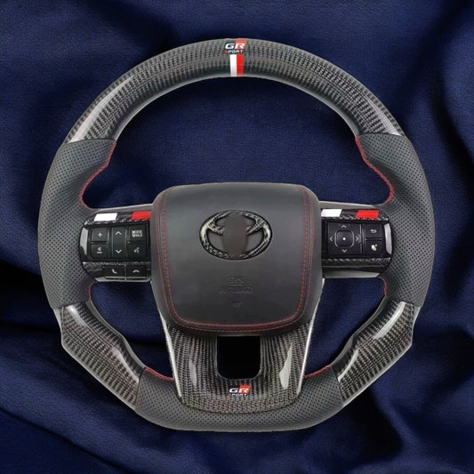 TOYOTA Hilux (2012-2024) - Carbon Fiber + Leather Steering Wheel with Airbag and Buttons