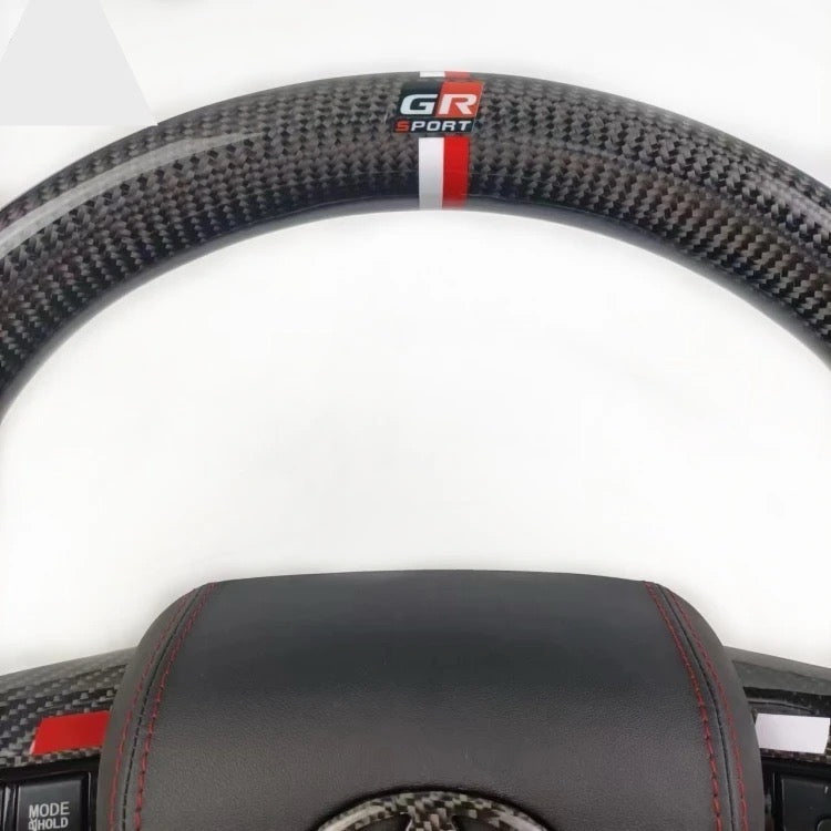 TOYOTA Hilux (2012-2024) - Carbon Fiber + Leather Steering Wheel with Airbag and Buttons